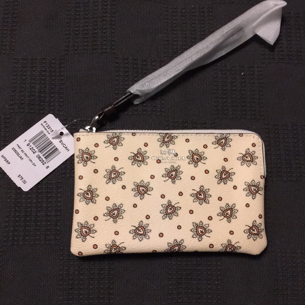 Women's Coach signature corner zip wristlet